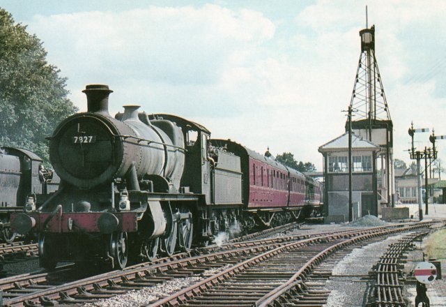 A second well was sunk around 1890 and deepened in 1899 but by December 1903 Swindon Works was consuming so much water that a pumping station was opened between the fork of the Tetbury Branch (on the right of the picture below)  and the Down Main Line, seen here being occupied by Collett 2-6-0 7327 (renumbered from 9305 in 1959) at the head of the 1320 Sundays Only Paddington-Gloucester service on 5 August 1962.