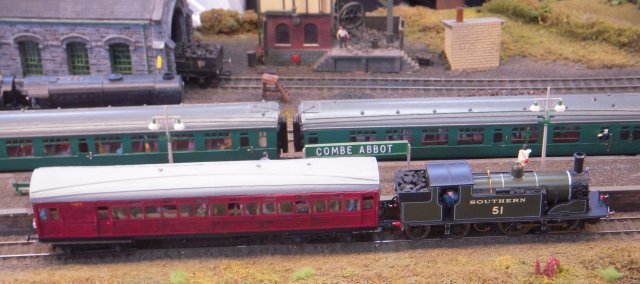 This branch terminus was joint GWR/ LSWR and became part of the SR at the 1923 Grouping. Set in Wiltshire around 1950, liveries were a mix of GWR, SR and early BR. Trains ran to Westbury (BR-W) and to Salisbury (BR-S). The latter included 3-coach sets which attach to Exeter-Waterloo services. There were also push-pull trains - as hauled by long wheelbase M7 0-4-4T 51, above, and  an equivalent GWR 0-6-0PT, seen with Schools 4-4-0 907 "Dulwich", below -  local goods, a weed-killing train and Army tank traffic to a sub-branch on Salisbury Plain. Built originally by Keith Blake from Bromsgrove, Combe Abbot was refurbished during 2010-12 and features a fiddle yard with eight train cassettes. Track on the 17' x 3' layout was SMP with wire-in-tube point operation and there were two Gaugemaster Combi controllers.