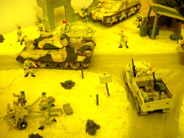 Among Mike's splendid dioramas newly presented at St Margaret's Hall were scenes of movement in the deserts of North Africa and the opposed amphibious assault on the Normandy beaches in 1944.  I particularly liked the waterspouts thrown up by German shells among the American landing craft, while still pushing back Rommel's Afrika Korps were an A15 Crusader tank leading one of the Chevrolet trucks of the Long Range Desert Patrol Group around a 25 pounder gun under the watchful gaze of a Lend-Leased Grant with a hull-mounted 75mm gun.
