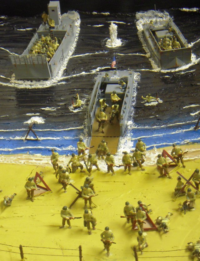 Among Mike's splendid dioramas newly presented at St Margaret's Hall were scenes of movement in the deserts of North Africa and the opposed amphibious assault on the Normandy beaches in 1944.  I particularly liked the waterspouts thrown up by German shells among the American landing craft, while still pushing back Rommel's Afrika Korps were an A15 Crusader tank leading one of the Chevrolet trucks of the Long Range Desert Patrol Group around a 25 pounder gun under the watchful gaze of a Lend-Leased Grant with a hull-mounted 75mm gun.