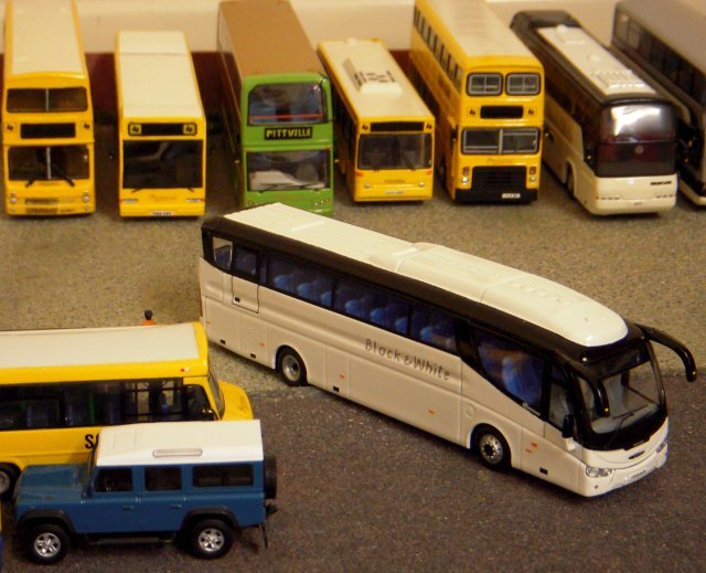 Out of the Travel 2000 depot on the school run in the meantime was one of Andy Peckham's three axle ex Hong Kong Alexander bodied Leyland Olympians while a former National Express Scania coach with Irizar bodywork remained in the yard, its Black and White livery contrasting with a blue and white Land Rover Defender.