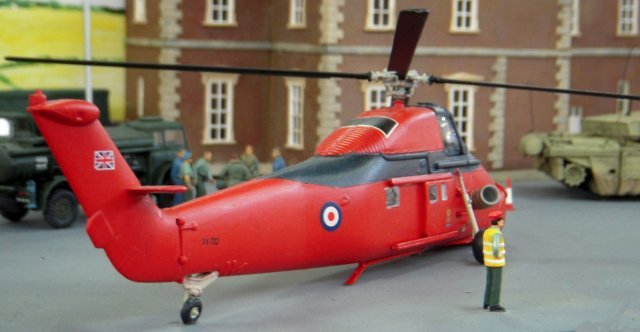 The main stores and office were constructed with the exteriors visible to exhibition visitors and on this occasion Dovington Camp was represented in the lead up to the Gulf War of 1990 with the local Guard's Brigade (made from classic Airfix Guards Colour Party and Guards Band soldiers adapted to carry SA80 rifles) parading to receive new Regimental Colours from the Preiser model of HM The Queen.  Whether HRH The Prince Phillip was allowed to fly Westland Wessex  XV732 of the Queen's Flight himself is not recorded.
