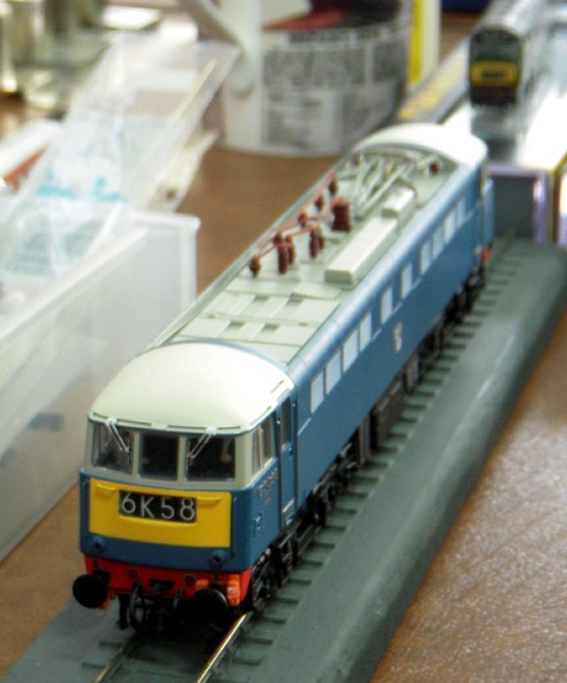 With a Western Region diesel hydraulic literally in the background for once, attention was drawn to E3058, originally a part of the forty strong Class AL5 built at Doncaster from 1961 to 1964 and later identified as 85 003 under TOPS.  Modelled wearing the original West Coast Main Line AC electric blue livery with aluminium lettering and cast bas-relief British Railways "ferret and dartboard" crest, the real 25 Kv overhead electric was to be withdrawn in 1991 and scrapped by MC Metals of Glasgow.