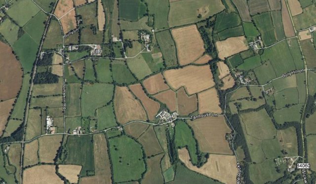 Although this tramway was marked on Ordnance Survey maps of 1890 it had been dismantled by 1900 although the route is still easily discernable due to a tree line in the 21st Century landscape.  There was also another unconnected tramway along the quarry on the south side of Tan House Farm.  This quarry flooded when quarrymen hit a spring and is now a well known carp fishing lake.  In both cases the B4060 road from Wickwar in the north to Chipping Sodbury in the south is visible on the right of the image.