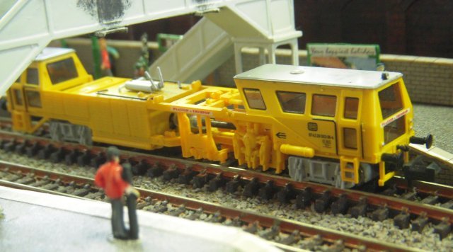 Owzat was a scenic N gauge layout that showed how much could be seen in a 4' x 2' space - namely a station on the figure of eight single track with passing loop serving a village complete with playground, church and local cricket team.  Among the small trains were DMUs, Thomas and Percy and a Hobbytrain Plasser Theurer Duomatic on-track machine.