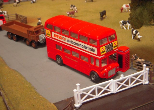 Once again very popular with the younger visitors, the Thomas layout included a Furness Railway liveried saddle tank engine at the had of a freight train mainly composed of road vehicles on flat cars as well as a Corgi model of a London AEC Routemaster bus next to another classic British design, Sir Giles Gilbert Scott's red telephone kiosk.  Rather spookily, a few days after the show, I received a birthday card with a picture of the exact same pairing!  What were the odds of that coincidence?  Rather than the route 11 on Sodor however, The Heart of the Garden Ltd's London Calling depicted a Routemaster on the Number 13 from Finchley Road to Golder's Green Station.