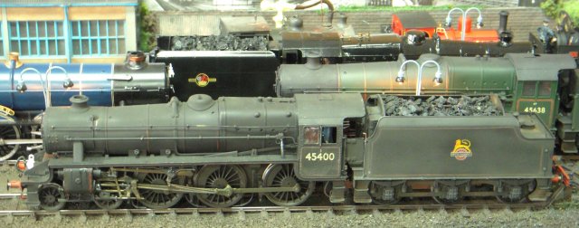 Motley Sub Shed, a minimum space 10' x 2' layout showcasing a "motley" collection of Rob's locomotives, assumed that the seaside town of Motley had a year-round passenger traffic  - including holiday trains from all over Britain in the summer - and freight trains to and from the harbour, which had its own private railway system worked by industrial locomotives.
