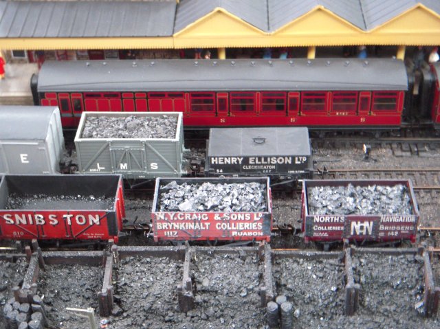 Smallcombe was the busy terminus at the end of the line from Bishopsmead -Ted's other layout - located "somewhere" on the Western / Central Division of the LMS in the 1930s.  The area was presumed to have a significant demand for frequent passenger services and a considerable requirement for all kinds of goods traffic to a warehouse, gasworks and dairy / creamery.  The rolling stock and buildings were a mixture of modified proprietory, kit, modified kit and scratchbuilt items.