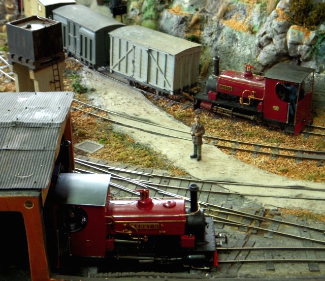 There is a valley called Cwn Teigl situated south east of Bleanau Ffestiniog which seemed a good place to set an imaginary narrow gauge railway that would have connected to the Festiniog Railway. There was a junction on the main line from which a tramway branch climbed steeply, partly following the road before entering a ledge on the rocky hillside. Passing a slate quarry it disappeared into a tunnel to serve the higher part of the valley. A slate works and a woollen mill ( complete with operational water wheel) were also served by the main line.