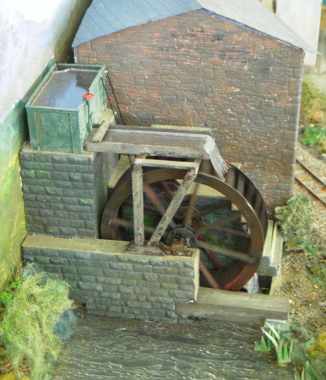 Teigl Tramway was built to 7mm scale ( the same as for 0 gauge ) but used 14mm gauge track to give the correct representation of 1' 11 1/2" gauge track used on the Festiniog, Penrhyn and Welsh Highland Railways. This choice of gauge - rather than commercially available 00 gauge 16.5mm track with wide spaced sleepers - meant that all trackwork had to be scratchbuilt and all rolling stock modified to run on it.