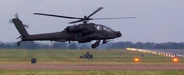 Just getting airborne below was this Boeing AH-64 Apache, the principal attack helicopter of the US Army and now being built for the British Army Air Corps under licence by Westland of Yeovil.  Designed as a replacement for the Hughes AH-1 Cobra of Vietnam war fame, this original Hughes design was selected in 1976 and the first production example rolled out in 1983.  The company was taken over by McDonnell Douglas in 1984 and the ultimate AH-64D Apache Longbow - distinguished by its circular rotor-top radome - is now a Boeing Integrated Defence Systems product.