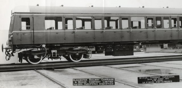 Carrying the B2 headcode nearest the camera was W56297, one of nine Driving Trailer Seconds built in July 1958 by the Gloucester Railway Carriage and Wagon Company for use with its Class 122 "Bubblecars" - such as W55016 seen behind it - and the Pressed Steel Class 121s on high density outer London commuter work.  Despite its cab being styled to match Gloucester's Class 122 railcars and Class 119 Diesel Multiple Units however, the 29 ton  W56297 - and W56298 seen in GRCW official photo  5423 above - featured 95 seats in a non gangwayed saloon only accessible via side doors. Terence's model of W56297 - which later bacame part of Class 150 under TOPS -  was built by heavily modifying a Lima Class 121.&nbsp;