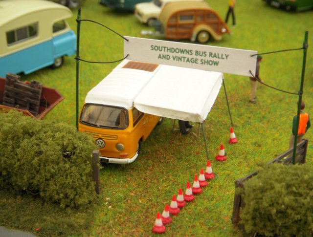This diorama is a small representation of the Southdowns Bus Rally and Vintage Show which is held annually in West Sussex over the Spring Bank Holiday weekend.  The venue is Fennel Farm located on the A286 between Chichester and Midhurst.  It is one of the most prestigious events in southern England, attracting exhibitors and visitors from far and wide and one of those "must see" events in the rally calendar.