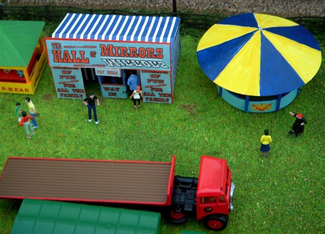 The atmosphere of the show was augmented, too, by the beer tent (seen above beyond the classic car display) and the fairground side shows - a trademark of Martin Nash who helped Vincent create his Southdowns Bus Rally and Vintage Show diorama.