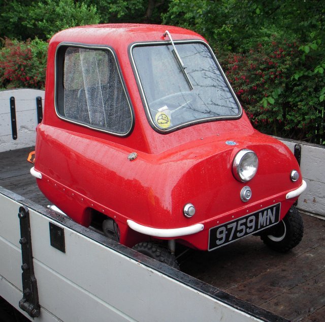 In my desire just to get aboard a train heading west from Castletown to Port Erin I did not stop to look at any of the Birmingham or Swansea built carriages, or indeed to realise that I was aboard my first car-carrying working!  This unique Manx approach to "Motorail" involved a suitably small automobile in the shape of a locally produced three wheeled Peel P50 coupe 9759MN.