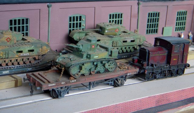 In the closing months of the Second World War much of British industry was busy producing vehicles for the final assault on Hitler's Festung Europa.  Universal Works had specialised in repairing gun tanks and modifying some of them into specialist machines following the lead of Major General Sir Percy Hobart and his so called "Funnies" which helped make the D-Day landings in Normandy a success.  As a result, a convoy of tracked armour was ready to leave the road outside while other weapons and vehicles moved around the works courtesy of the motive power available at the time. 