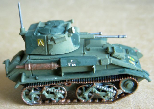 The Tank, Light, Mk VI was the sixth in the line of similar vehicles built by Vickers-Armstrong for the British Army, having a degree of standardization with their previous five models. The Mark VI turret, which had been expanded in the Mark V to allow a three-man crew to operate the tank, was further expanded to give room in its rear for a wireless set. The weight of the tank was increased to 10 800 pounds (4 900 kg) - which although heavier than previous models actually improved its handling characteristics - and an 88 horsepower (66 kW) engine was added to the model to increase its maximum speed to 35 miles per hour (56 km/h).
