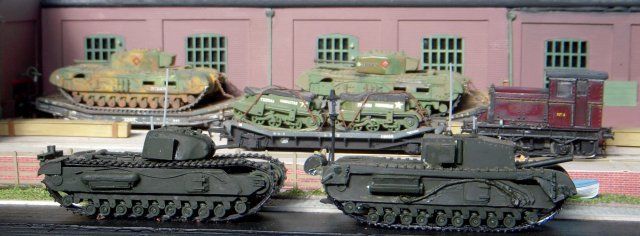 In the closing months of the Second World War much of British industry was busy producing vehicles for the final assault on Hitler's Festung Europa.  Universal Works had specialised in repairing gun tanks and modifying some of them into specialist machines following the lead of Major General Sir Percy Hobart and his so called "Funnies" which helped make the D-Day landings in Normandy a success.  As a result, a convoy of tracked armour was ready to leave the road outside while other weapons and vehicles moved around the works courtesy of the motive power available at the time.