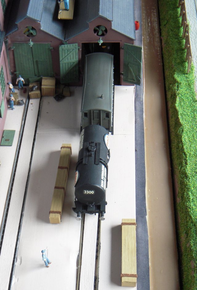 Arguably the most famous tank wagon ever to appear as a 4mm scale kit was of Esso Class B 3300, first injection moulded by Rosebud Kitmaster, then Airfix, and now sold under the Dapol banner. In comparison with the other designs discussed above, this wagon has a simple yet elegant twin-saddle attachment between cylinder and chassis although the 22' 6" cylinder noticeably stops short of the full length of the chassis ( 27' 9 3/4" over buffers ) and is far enough inside the loading gauge to permit sub-solebar length ladders to be attached amidships. Other visible refinements include roller bearing axle boxes and two brake blocks acting on each wheel. The latter were applied either by manual lever during shunting or by twin vacuum cylinders as part of a vacuum brake fitted train. Like later airbraked monocoque tank wagons, the buffers were either hydraulic or pneumatic.