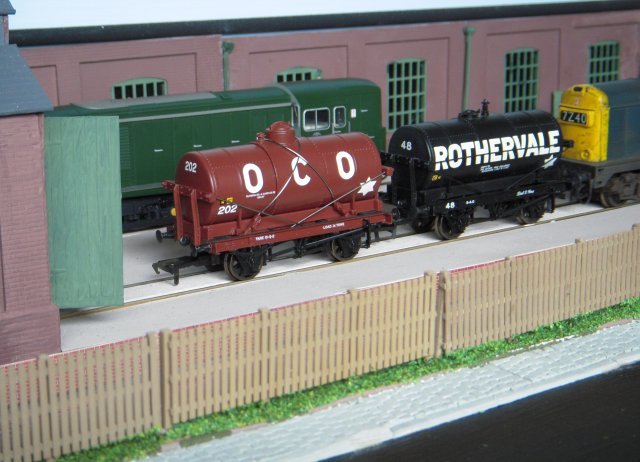 While rectangular tanks sufficed for the bulk transport of coal tar, the more volatile products of coal tar - and crude oil - including required petroleum, creosote, ammoniacal liquor, acids and dyes, required cylindrical tank wagons of more advanced design that were introduced from the start of the 20th Century. However, these did not become commonplace until the arrival of specialised rail-connected reception facilities during the 1920s
