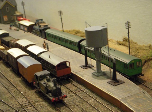 ocomotives and rolling stock were visible from all over the Southern Railway and its pre Grouping constituents in an era before Nationalisation and the closures that created the Southern Region's "Withered Arm" in the far west.  In particular I liked the green two-car push-pull set powered by Drummond Class M7 0-4-4T 249, seen below alongside a peripatetic Brighton Terrier, and Maunsell designed Class N 2-6-0 1850, seen taking on coal above