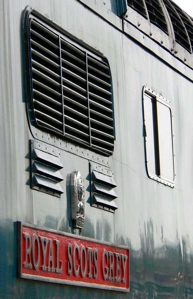The production locomotives were all dedicated, and carried nameplates to symbolise this. They would either represent important army regiments; particularly those of Scotland, such as the Royal Highland Fusiliers and Royal Scots Grey (illustrated left), or famous racehorses that had raced at Grand National races or royal events, such as “Alycidon” and “Ballymoss”. These quirky names were soon a memorable feature of the Deltic fleet, and were easily identified by these iconic names. Another fascinating, unique aspect of the locomotives was the distinctive thundering noise that their engines made. This was especially apparent as they either pulled out of stations or accelerated past the bewildered, waiting passengers, at a speed of 100mph with around twelve carriages densely loaded with passengers, and this is one of the reasons as to why they are so popular with rail enthusiasts. 
