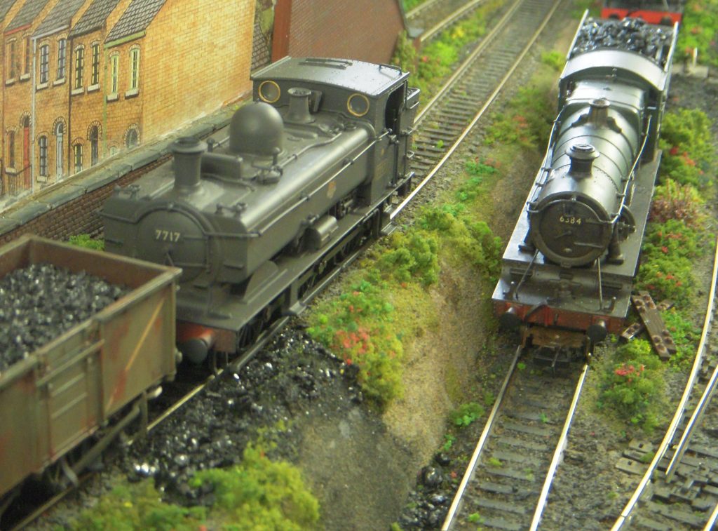 This layout was built by Peter Cullen when he was a member of Solihull MRC. It represents a typical sub-shed located somewhere in the industrial West Midlands on the Western Region of British Railways during the mid-1960s.